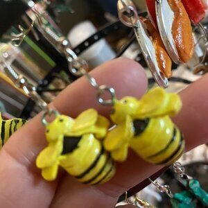 Handpainted and crafted honey bee dangle clay earrings.